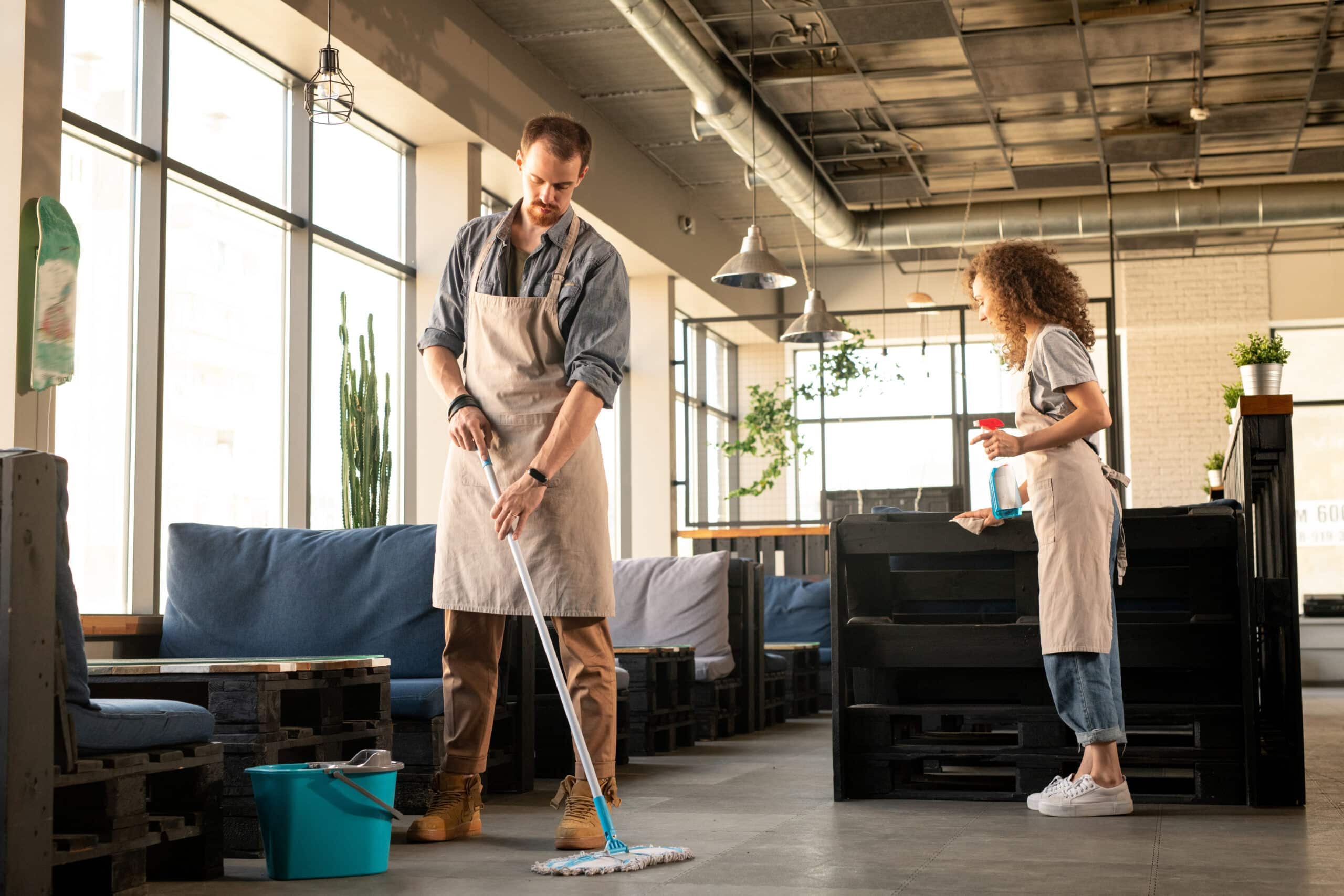Couple preparing cafe before opening